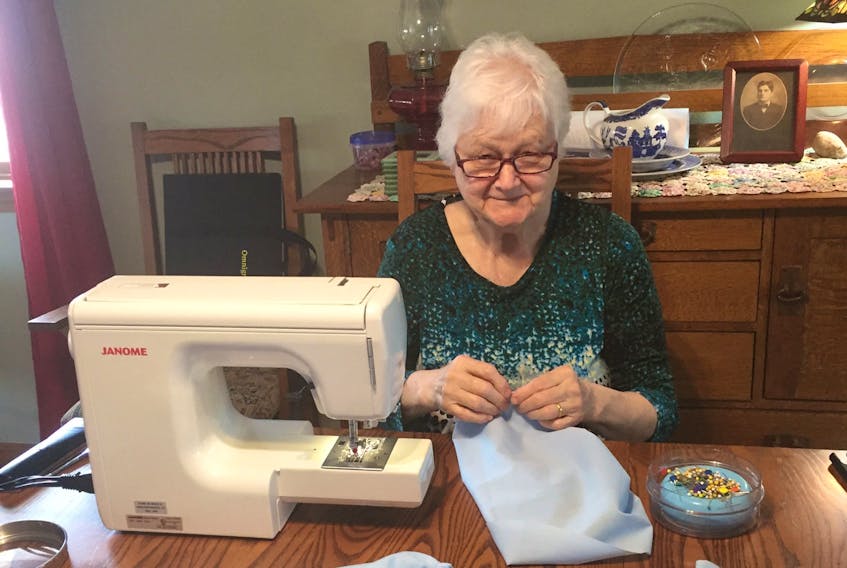 Pat MacIntyre, president of the Quarry Point Quilt Guild, sews sleeves in her Glace Bay home last month. The sleeves were then attached to short-sleeve resident gowns, turning them into isolation gowns for Seaview Manor. Seaview Manor CEO Eric Doucette came up with the idea to modify some of their current supply of gowns to make 155 isolation gowns, which can be washed on site, in case residents contracted COVID-19, after finding it difficult to buy them.
