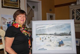 Mary Mullins, 72, stands beside one of her favourite paintings, which will be on display for her first solo art exhibit - Nostalgia. Taking place at the Main Street Gallery, inside the New Waterford Credit Union, the opening for the show is June 28 from 3 p.m. – 4:30 p.m.