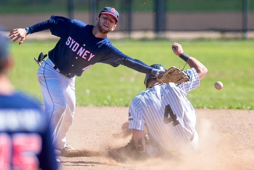 The throw from the catcher sails past Sydney Sooners shortstop Chris Farrow as Dartmouth Moosehead Dry centre fielder Chris Head of River Ryan steals second base during Game 2 of the Nova Scotia Senior Baseball League final at Dartmouth’s Beazley Field on Sunday afternoon.
