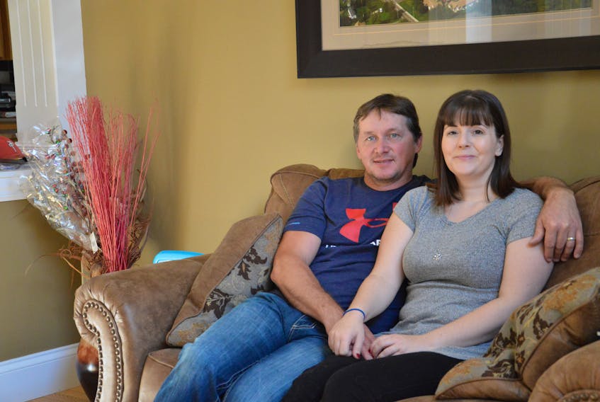 Tim and Renee Smith sit in their home in Sydney Mines. Tim, owner of a construction company, was on track to retire early until a car accident left Renee with serious brain injuries and they had to go to the United States for surgeries to help her. Nikki Sullivan/Cape Breton Post