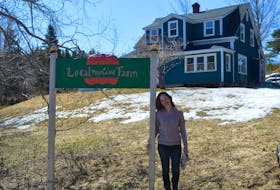 Jody Nelson stands at the entry of her LocalMotive Farm in Hunter’s Mountain, Victoria County, on Monday. Nelson also works for Ecology Action as a community food coordinator for Cape Breton, which oversees the Island Food Network.