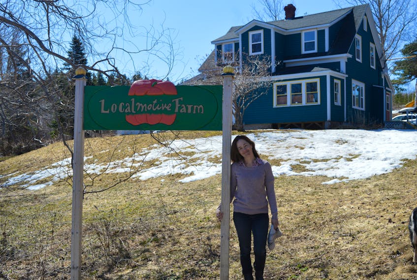 Jody Nelson stands at the entry of her LocalMotive Farm in Hunter’s Mountain, Victoria County, on Monday. Nelson also works for Ecology Action as a community food coordinator for Cape Breton, which oversees the Island Food Network.