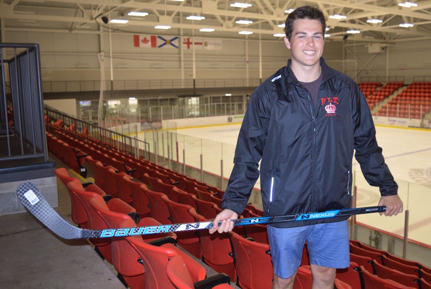 Jake Brien of Sydney holds his hockey stick near the ice surface at the Membertou Sport and Wellness Centre on Monday. The 21-year-old has played the last three years in junior ‘A’ in British Columbia and Ontario and will continue his career with the Toronto Varsity Blues this season.