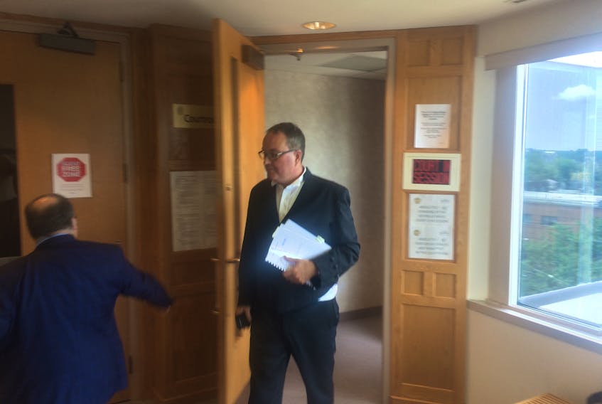Tony Mozvik, shown exiting a Sydney courtroom on Friday, has been representing the Cape Breton Regional Municipality in the constructive dismissal case involving former CBRM economic development officer John Whalley. It is now up to a Supreme Court justice to decide whether Whalley was pushed out of his job or left voluntarily.