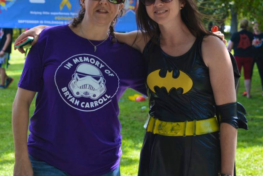 Marsha Stephens, left, stands beside Nicole Forgeron, organizer of the Superhero Walk, Run or Fly event. Stephens comes from Dartmouth for the event to honour her son who died from cancer when he was seven years old.