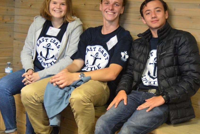 Amoena Iding of Germany, from left, Ewout van Waasbergen of the Netherlands, and Nicolas Cueva Andrada of Ecuador are participating in the International Student Program. It’s their first time in Canada.
