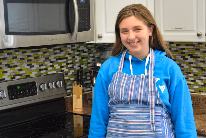 Hannah Lynk stands in the kitchen of the Whitney Pier Boys and Girls Club on Tuesday. The 11-year-old Sydney resident was one of the winners of the Kid Food Nation's national recipe contest.
