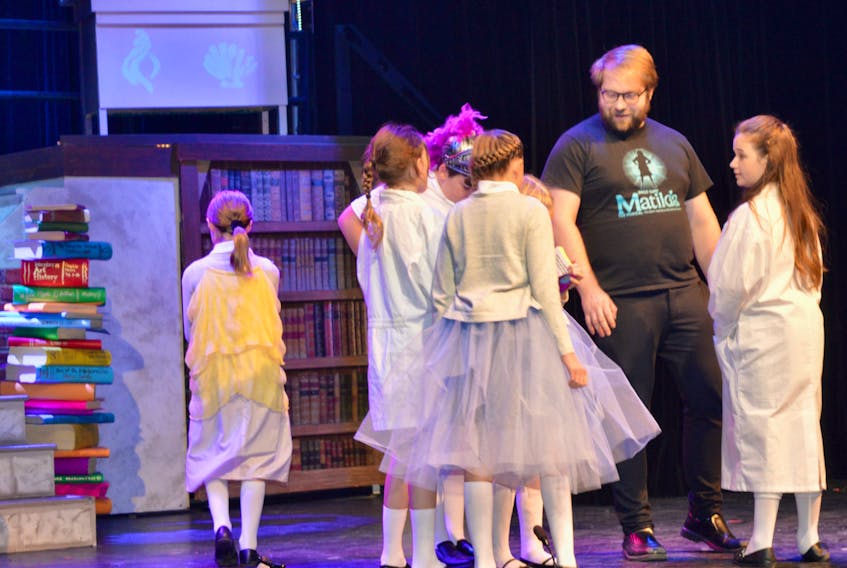 Wesley Colford works with several young performers during a rehearsal of “Matilda The Musical” at the Savoy Theatre in Glace Bay last fall. Plans to restage the production in February have been cancelled.