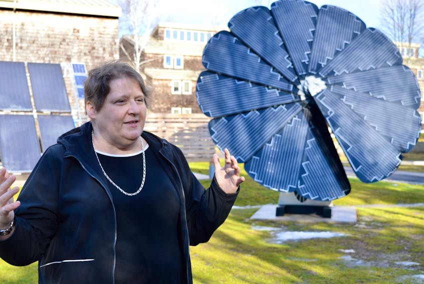 Joan Muise, project manager for Public services and Procurement Canada, explains how a solar flower works at the Canadian Coast Guard College Friday. The site’s two flowers are just a small part of the ongoing process to make the college a greener facility.