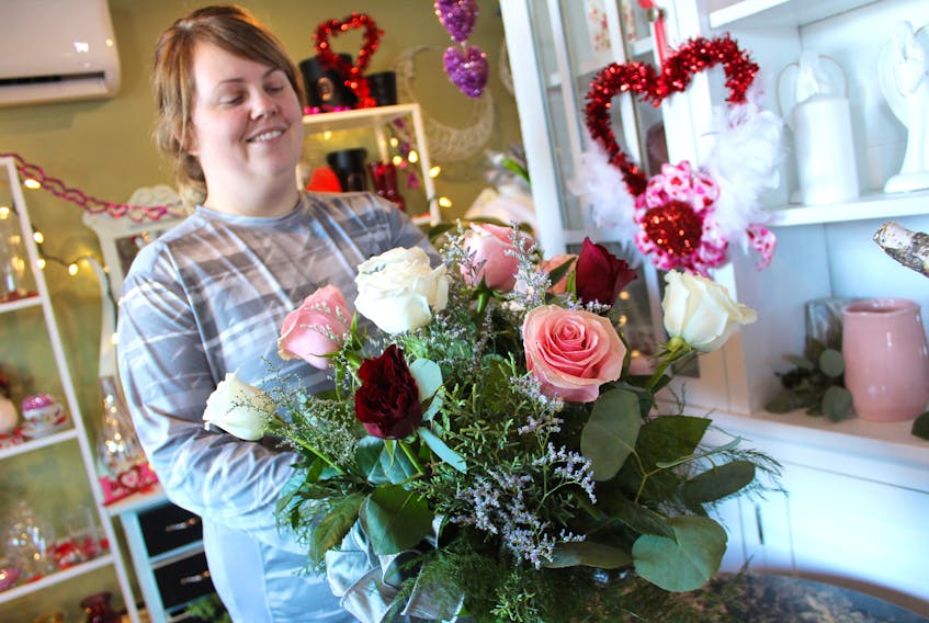 Amanda O'Neil, a florist at Family HeirBlooms in New Waterford, puts the finishing touches on an arrangement featuring a dozen multi-coloured roses. With another location-based in Membertou, the floral business is headed toward a busy time of year as customers place orders for Valentine's Day. O'Neil said in her experience, roses remain a top pick for the special occasion.