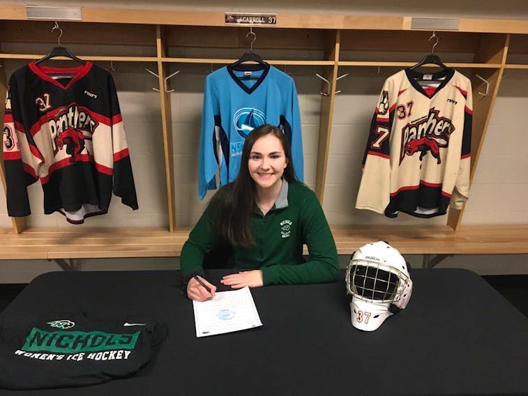 MacIntyre Chevy Panthers goaltender Julia Carroll is shown signing recruitment papers to attend Nichols College in Dudley, Mass. The graduating goaltender is expected to battle for the NCAA team’s starting job. PHOTO SUBMITTED/PAUL CARROLL