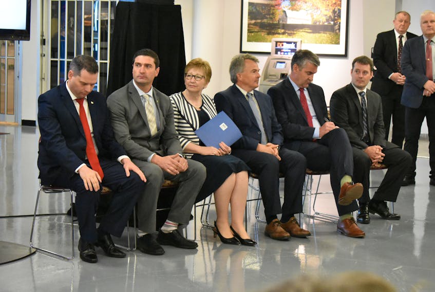 From left, Sydney-Whitney Pier MLA Derek Mombourquette, Glace Bay MLA Geoff MacLellan, Nova Scotia Health Authority CEO Janet Knox, Dr. Paul MacDonald, Premier Stephen McNeil and Health and Wellness Minster Randy Delorey hear the jeers and boos from the crowd as the new plan for the delivery of health care in Cape Breton was announced at the Joan Harriss Cruise Pavilion in Sydney on Monday.