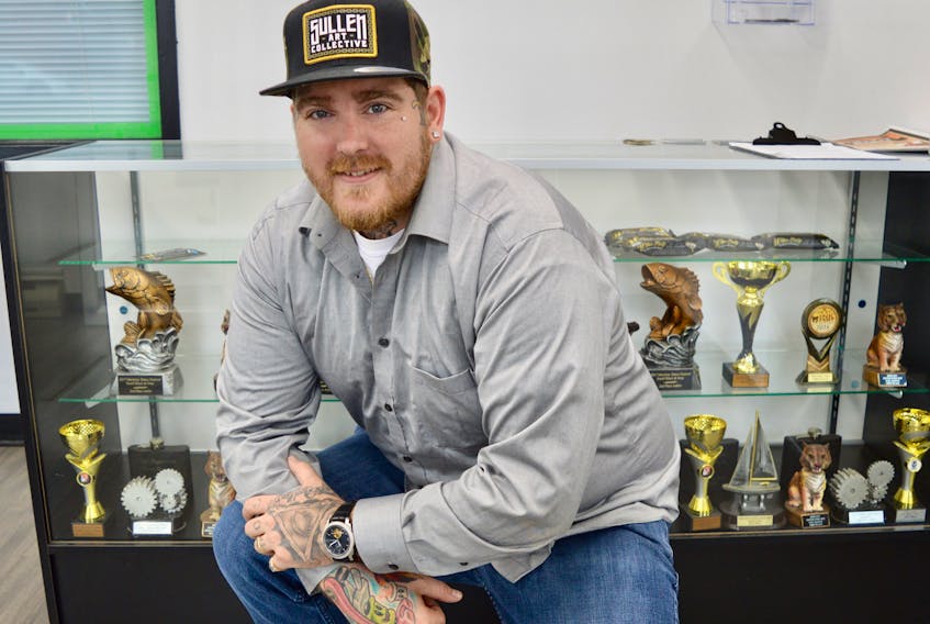 Travis Lawless is a man of many talents and can be found at the Tat Tomb Gallery where he does award-winning tattoos or on stage where he performs as Import, a hip hop artist.