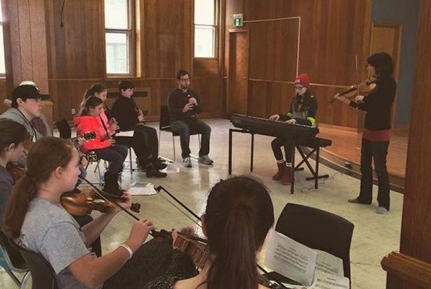 In this file photo, instructors Keith MacDonald on the chanter, and Kimberley Fraser on the fiddle, perform with students from Feis Cape Breton’s 2015 youth mentorship program.
