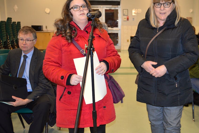 Tammy MacInnis, left, and Brenda MacLean address the Cape Breton-Victoria Regional School Board during its monthly meeting Monday night at Sherwood Park Education Centre in Sydney. Looking on is board director of operations Paul Oldford. MacInnis and MacLean both said they are concerned floor tiles at John Bernard Croak VC Memorial School in Glace Bay could contain asbestos.