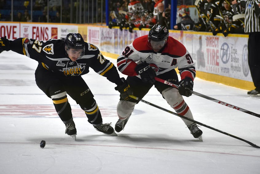 Gabriel Proulx of the Cape Breton Screaming Eagles, left, keeps tabs on Yvan Mongo of the Drummondville Voltigeurs during Game 3 of their Quebec Major Junior Hockey League playoff series on Monday at Centre 200.