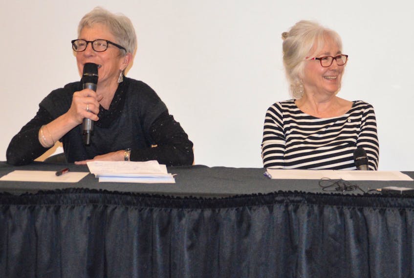 From left, Rhoda MacCormick and Joella Foulds share a laugh during an information session on medically assisted death Thursday. The two were friends of the late Weldon Bona.