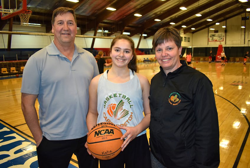 Basketball Cape Breton will play host to teams from across the province this weekend for the sixth annual Cape Breton Classic. From left are BCB Capers U14 girls team assistant coach Rob Clemens, post player Katie Clemens, and head coach Leslie Timmons.