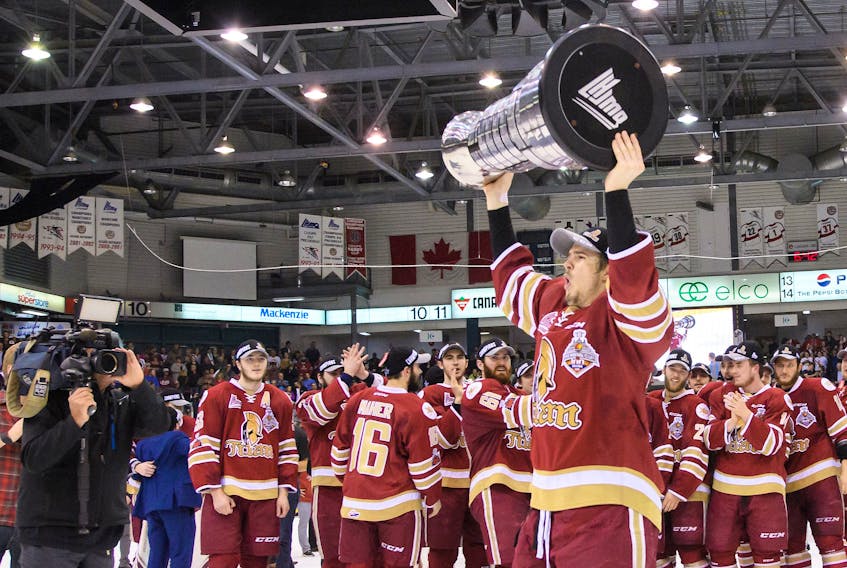 Acadie-Bathurst Titan forward Mitchell Balmas of Sydney hoists the President Cup after defeating the Blainville-Boisbriand Armada 2-1 in Game 6 of their best-of-seven Quebec Major Junior Hockey League championship series on May 13 in Bathurst, N.B. The 20-year-old has been invited to the Philadelphia Flyers rookie camp in September.