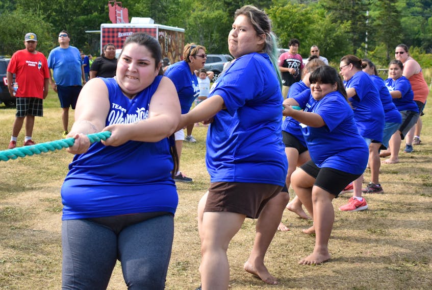 Lateesha Denny, left, and Rebecca Peck, lead their Wagmatcook teammates in a game of tug of war during the 2018 Nova Scotia Mi’kmaw Summer Games that wrapped up Sunday. Hundreds of competitors and onlookers from across the province gathered in Eskasoni for the eight-day event.