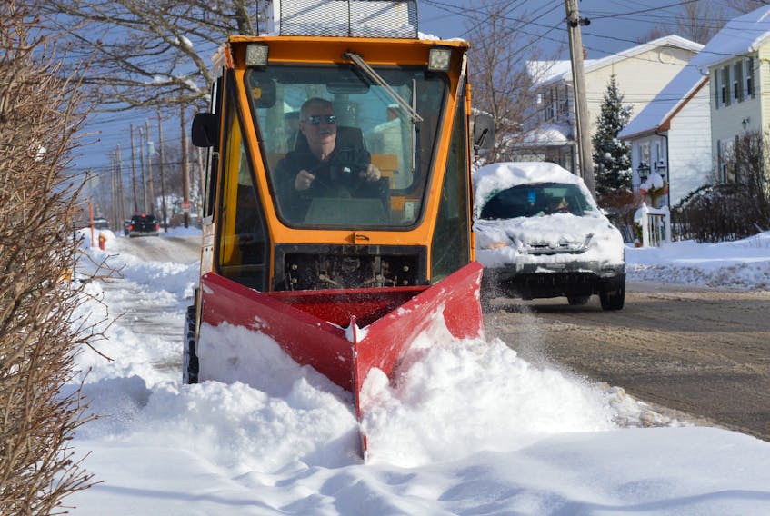 In this file photo, a sidewalk plow clears a Sydney sidewalk after a winter storm.