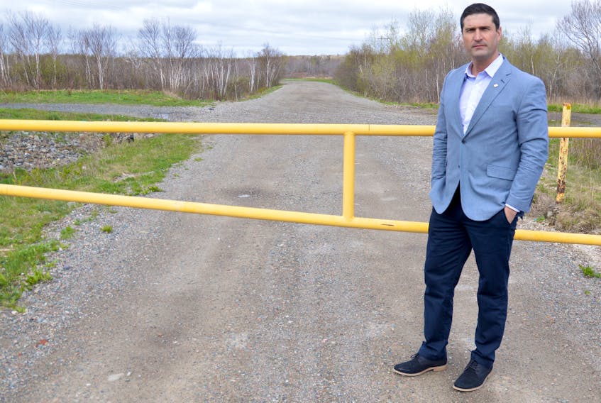 Glace Bay MLA Geoff MacLellan stands on a dirt road off Brookside Street in Glace Bay where the former Glace Bay dump was once located, the entrance for the new Donkin coal road being built in Glace Bay. MacLellan, who is also Nova Scotia minister of business, said the design is ready for tender they are just waiting for Donkin Mine to acquire the remaining parcels of land required.