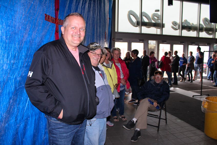 Tickets sales for the upcoming Johnny Reid Christmas concert were off to a fast start on Friday morning as evident by the long line of fans waiting to purchase tickets from the Centre 200 box office. On the far left is Frank Martin who parked outside of Centre 200 at 4 a.m. on Friday and was first through the doors of the centre at 8 a.m. even though ticket sales did not begin until 10 a.m. Martin said his wife, Colette, is a big fan and he wanted to make sure she had good seats. The Martin’s own the popular Colette’s restaurant in Glace Bay and Colette was on the job Friday while Frank stood in line. To his immediate left was Allan Lewis as the second person in line to buy tickets along with is wife Debbie (not shown). Many others stood in a long line that stretched around the inside of Centre 200. Reid’s “My Kind Of Christmas” tour comes to Centre 200 on Nov. 21 and celebrates his latest album, the Christmas EP, “My Kind of Christmas, which is coming out Oct. 25.
