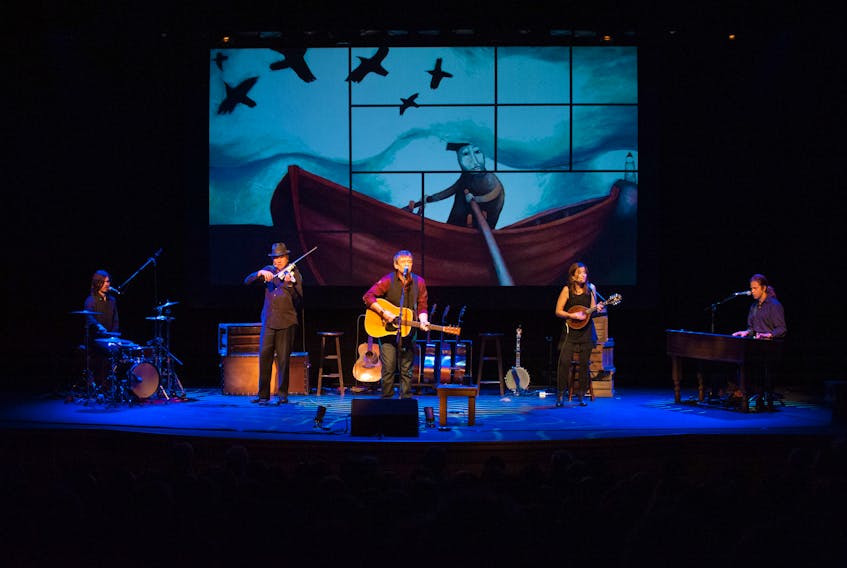 Singer/songwriter Lennie Gallant and his band perform “Searching for Abegweit.” The group is now on tour and will appear this evening in Port Hawkesbury. Shown here, left to right are, Jonathan Gallant on drums, Sean Kemp on violin, Lennie Gallant on guitar, Patricia Richard on mandolin, and Jeremy Gallant on keyboards. Submitted photo