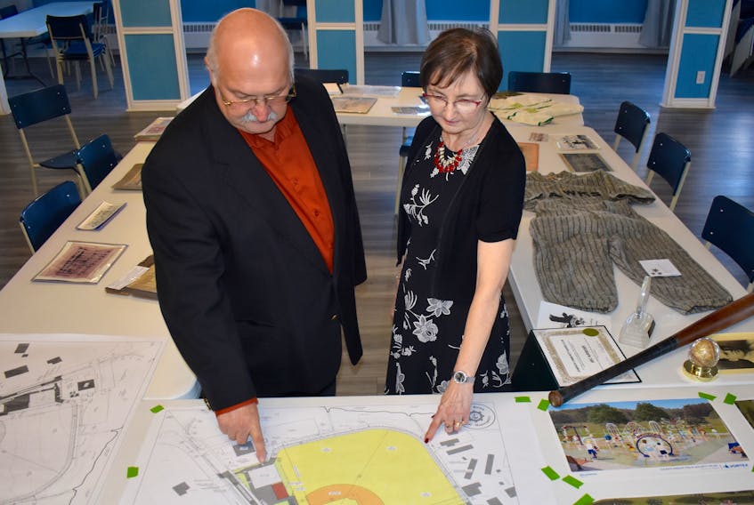Hawks Dream Field society members Sheldon Saccary, left, and Toni McNeil, look over a conceptual drawing of what the existing Dominion sports facility will look like when the project is completed. Plans call for the revitalization of the old ball field into a modern, fully-accessible and inclusive recreation facility for people of all ages, abilities, gender and socio-economic status. The group held an information session, including a multi-media presentation, to the community on Wednesday at the Dominion legion.