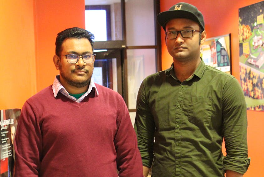 Tahlil Akter, left, and M.D. Abdul Halim Himel, stand in a hallway at Cape Breton University where they are first-year students. The men are from Bangladesh and had trouble finding a suitable rental unit when they first arrived for the 2019-2020 school year. They feel some international students are being taken advantage of by local landlords and hope telling their story will assist other newcomers to Canada.