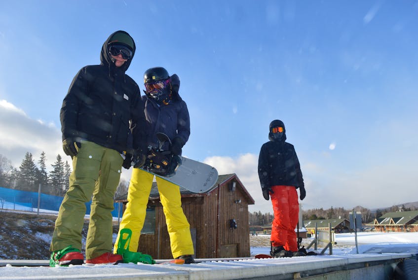 Matthew Gillespie, Leah Gillespie and Avery Gale were among the hundreds of skiers and snowboarders to enjoy opening day at Ski Ben Eoin on Wednesday. GREG MCNEIL/CAPE BRETON POST
