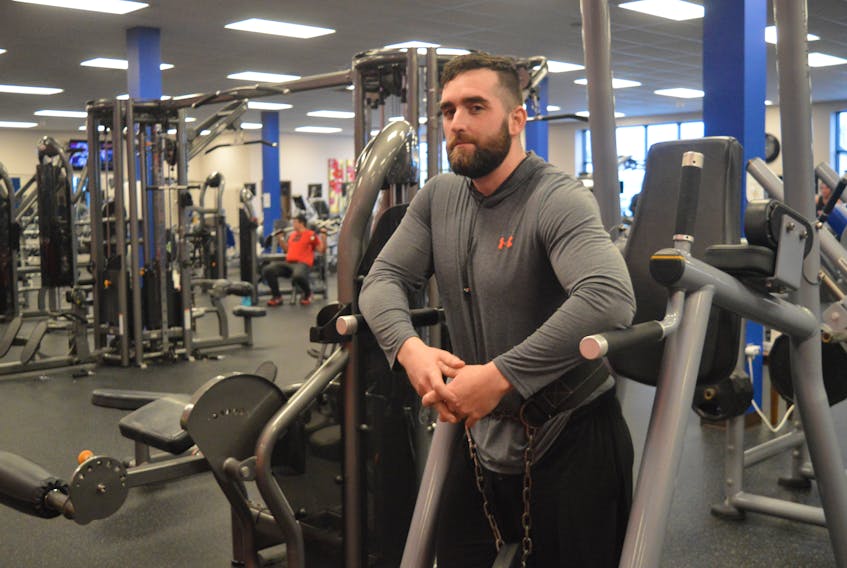 Dylan Yates, 26, hangs out in Platinum Fitness in Glace Bay, his “second home.” Being diagnosed with VHL, an incurable genetic condition that causes tumours to continuously grow, is motivating him to be a better person and to encourage others to do the same. Nikki Sullivan/Cape Breton Post
