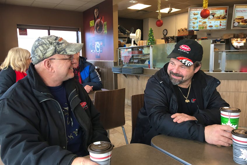 Transport drivers Raymond Surette, left, and Romeo Allain are shown chatting and having a coffee at the Tim Hortons outlet in North Sydney, Wednesday. The truck drivers, both heading to Newfoundland, have been stuck in North Sydney with ferry crossings being cancelled due to high winds. JEREMY FRASER/CAPE BRETON POST