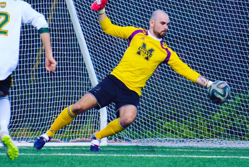 New Waterford’s Kevin Abraham of the Mount Saint Vincent Mystics makes a left-hand save during Atlantic Collegiate Athletic Association action against St. Thomas University. Abraham was diagnosed with cancer last year and had successful surgery to remove a tumour on his rib in August 2017. One year later, he’s back on the soccer field as the Halifax university’s No. 1 keeper.
