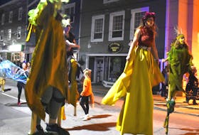 Stilt walkers from the River Clyde Pageant are shown as they make their way down Charlotte Street as part of the Lumière parade. The group is from Prince Edward Island and attended this year’s festival.