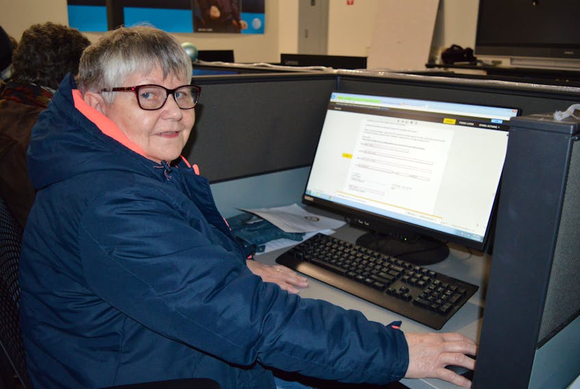 Longtime ServiCom employee Pearl Hayes of New Waterford fills out paperwork to register for work with the newly named Sydney Call Centre Friday. Another registration session for those work had worked for ServiCom in 2018 will take place today.