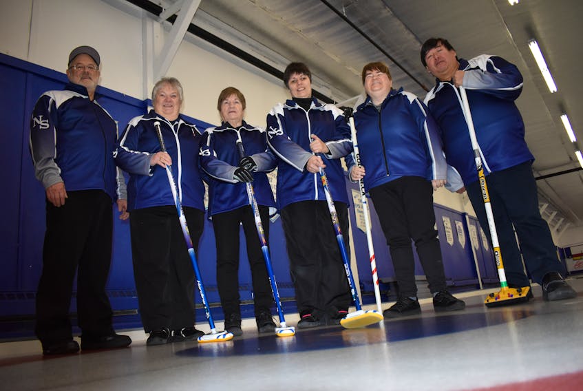The Louise Gillis rink will compete at the AMI Canadian Vision Impaired Curling Championship in Ottawa, Feb. 5-13. From the left are coach/guide Garth Nathanson, skip Louise Gillis, mate Christina Lewis, sweeper/second Terry Lynn MacDonald, lead Mary Campbell and coach/guide Sidney Francis, just before a practice session at the Sydney Curling Club on Friday.