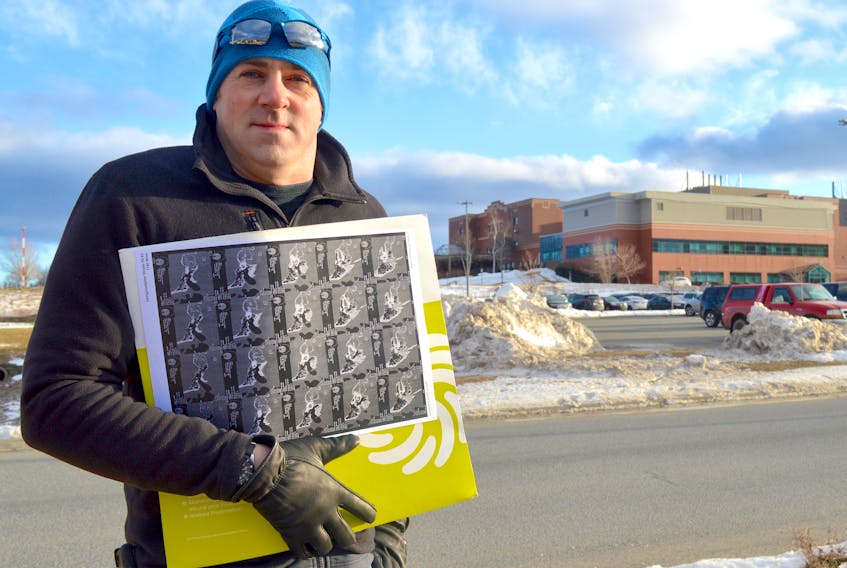 Jonathan Lewis stands outside the Cape Breton Regional Hospital with medical documents he received during a trip to Austria for surgery on his left ear. The 40-year-old Edwardsville man says he suffers debilitating pain in his ear, which was operated on to remove a growth in 2015. He believes a doctor in Texas can cure his symptoms but the province won’t pay for the cost of the procedure.