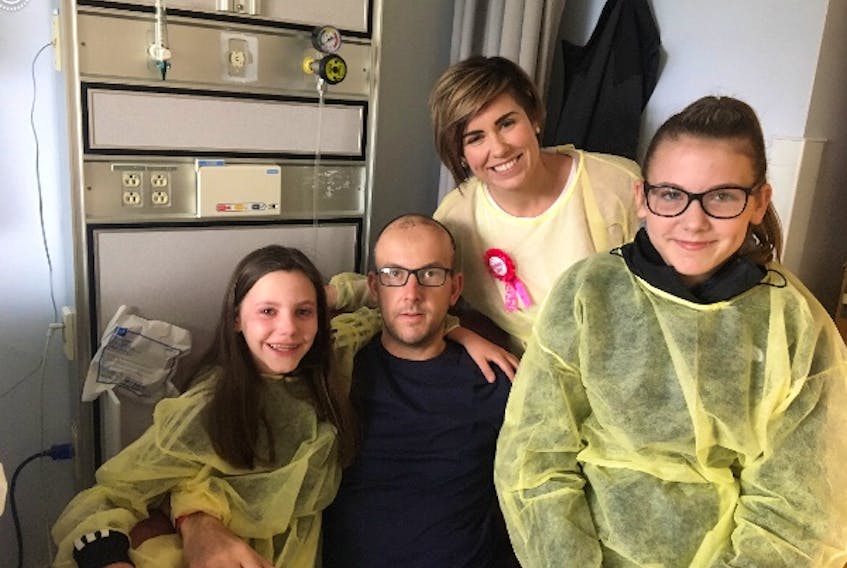 Brad Maxner of Glace Bay relaxes with his family, from left, daughter Avery, 9, wife Lindsey, and daughter Zoey, 11, in this photo taken in hospital in Halifax after Maxner returned from Cuba. Family members say that Maxner, who suffered a skull fracture and brain injury in Cuba on April 5, is making big improvements every day.