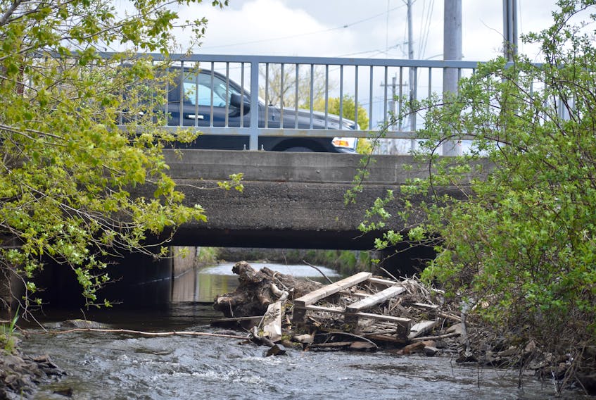 The Wash Brook flows through a channel under Townsend Street on Tuesday. There’s no relief in sight for residents and business owners in the flood-prone section of Sydney, according to a senior water resources engineer’s report to Cape Breton Regional Municipality council.