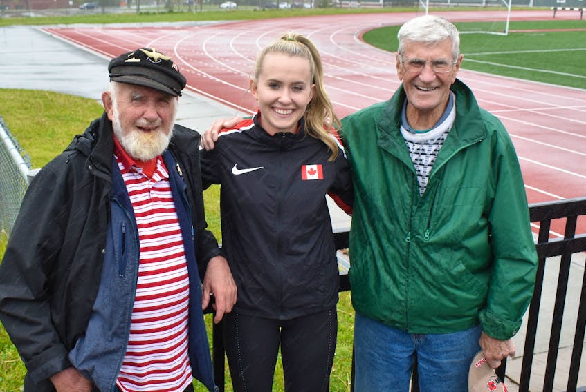Lauren Gale, centre, whose family roots run deep in Cape Breton, stands with grandfathers Joe Gale, left, and Ivan Green, prior to a recent training session at the Cape Breton University track. The 18-year-old, who has spent the past three years in Colorado after her military father accepted a NORAD posting, is heading to Finland, where she will compete for Canada at the 2018 IAAF World U20 Track and Field Championships.