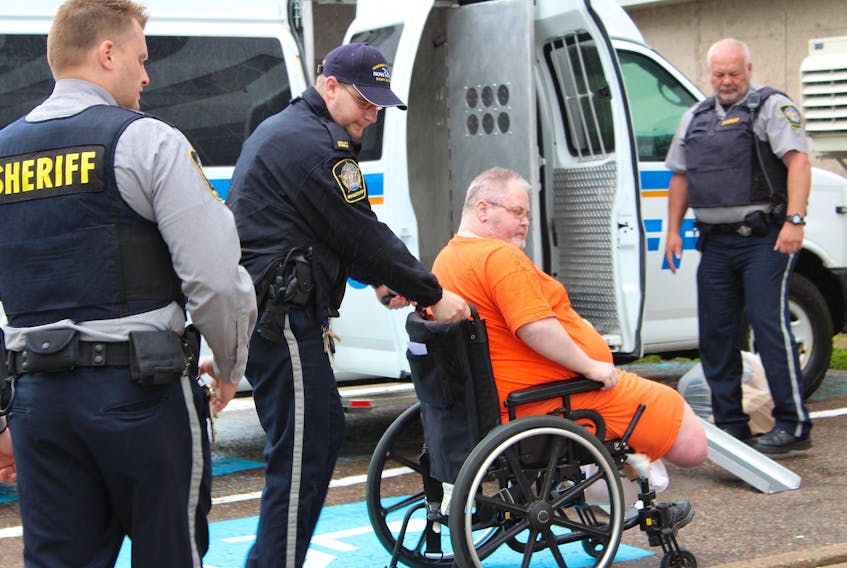 Glenn Farrow is wheeled into a Nova Scotia Supreme Court appearance at the Sydney justice centre on Friday morning.