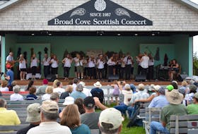 Members of the Cape Breton Fiddlers Association stretch from one end of the stage to the other during a mid-afternoon performance at the 62nd annual Broad Cove Scottish Concert on Sunday. While some early afternoon rains caused a slight delay in starting, the long-running showcase of Scottish music continued under beautiful blue skies and warm temperatures as the concert ran on into the evening.