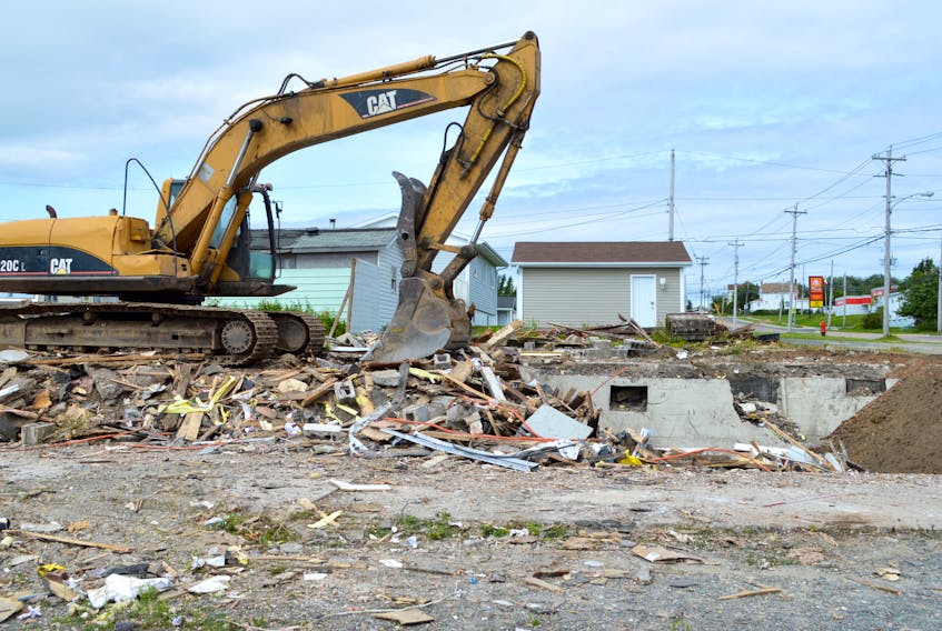 The former New Waterford Home Hardware store on Ellsworth Avenue — a building that is almost 100 years old and at one time was a grocery store — is now history. The building was torn down on Tuesday and clean-up efforts were continuing Wednesday. The new Home Hardware store can be seen far right.