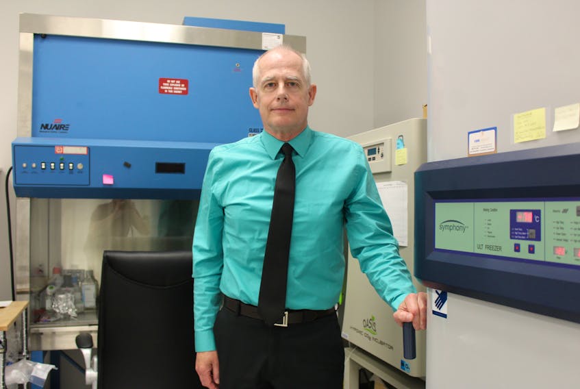 Dr. William Harless, who is seeking Health Canada approval to move forward with an early stage clinical trial of a drug cocktail that could limit the spread of pancreatic cancer following primary cancer treatment, stands next to one of the freezers holding dozens of blood and tissue samples of Cape Breton cancer patients. As part of his research at the Cape Breton Cancer Centre in 2014, Harless sought local volunteers to assist in developing a therapeutic treatment to stop the spread of cancer cells in the body that were triggered an inflammatory response such as surgery, chemotherapy or radiation.