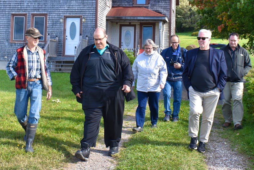 Big Pond Centre resident Roy MacInnis, left, leads members of the Nova Scotia Utility and Review Board on a site inspection of a proposed RV park and campground that could be located next to his farm in this file photo from September 2018. Also pictured, from left, are UARB hearing chair Roland Deveau, UARB member Roberta Clarke, appellant group representative Jim MacDonald, UARB member David Almon and developer Chris Skidmore.