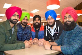 Some students originally of India and now living in Cape Breton and attending Cape Breton University gathered in the cafeteria at lunch time including, from the left, Harjinder Singh, 24 and Jaskaran Singh, 23, both in the business supply and management program, Jaspreet Singh, 23, and Simranjeet Singh, business management program, and Daljit Singh, 24, electronics and control. The students all say they don’t mind people asking questions about their Sikh faith, including their turban, as they know people are curious and want to learn about it.