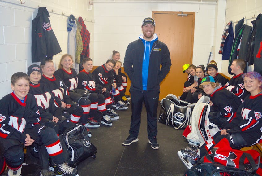 The Glace Bay Miners peewee ‘A’ hockey team listens to their coach, Kenzie Wadden, middle, prior to an exhibition game at the Dominion and District Community Centre, Friday. The team hopes to once again win the annual Chevrolet Good Deeds Cup. Jeremy Fraser/Cape Breton Post