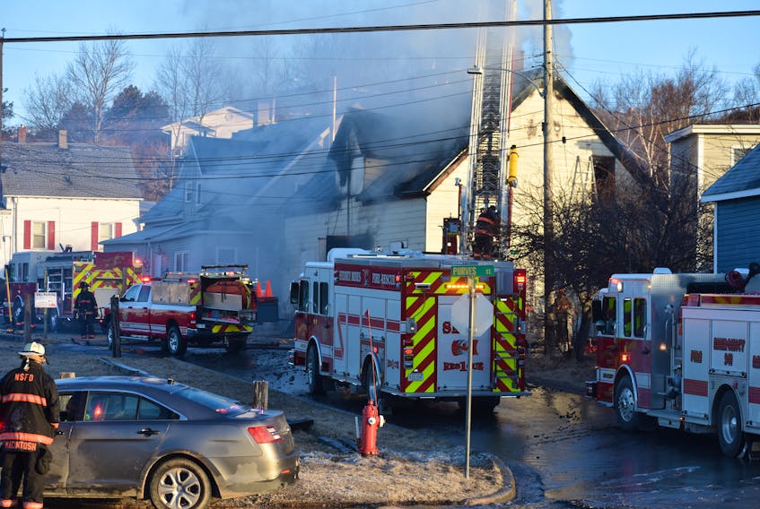 In this file photo from Tuesday of this week, an early morning fire destroys a vacant duplex on Forrest Street in North Sydney. Firefighters from the North Sydney and Sydney Mines volunteer fire departments are shown at the scene. On the same day, the association representing chiefs and deputy chiefs of the municipality’s volunteer fire departments issued a motion of non-confidence in the CBRM’s fire administrators.