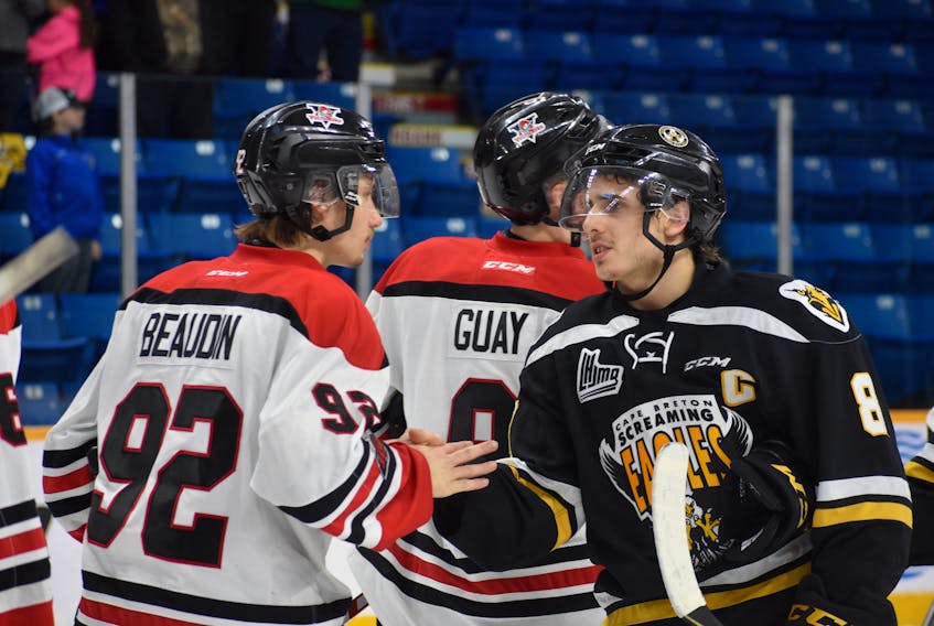 Phélix Martineau, right, of the Cape Breton Screaming Eagles shakes the hand of Nicolas Beaudin of the Drummondville Voltigeurs following Game 5 of the Quebec Major Junior Hockey League first round playoff series between the two teams. Thursday’s game marked Martineau’s final major junior game with the Screaming Eagles.